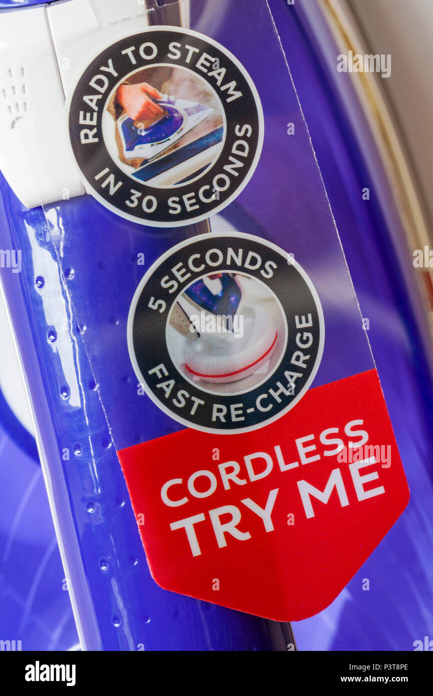 Cordless try me ready to steam in 30 seconds 5 seconds fast re-charge labels on Russell Hobbs Freedom Cordless iron Stock Photo