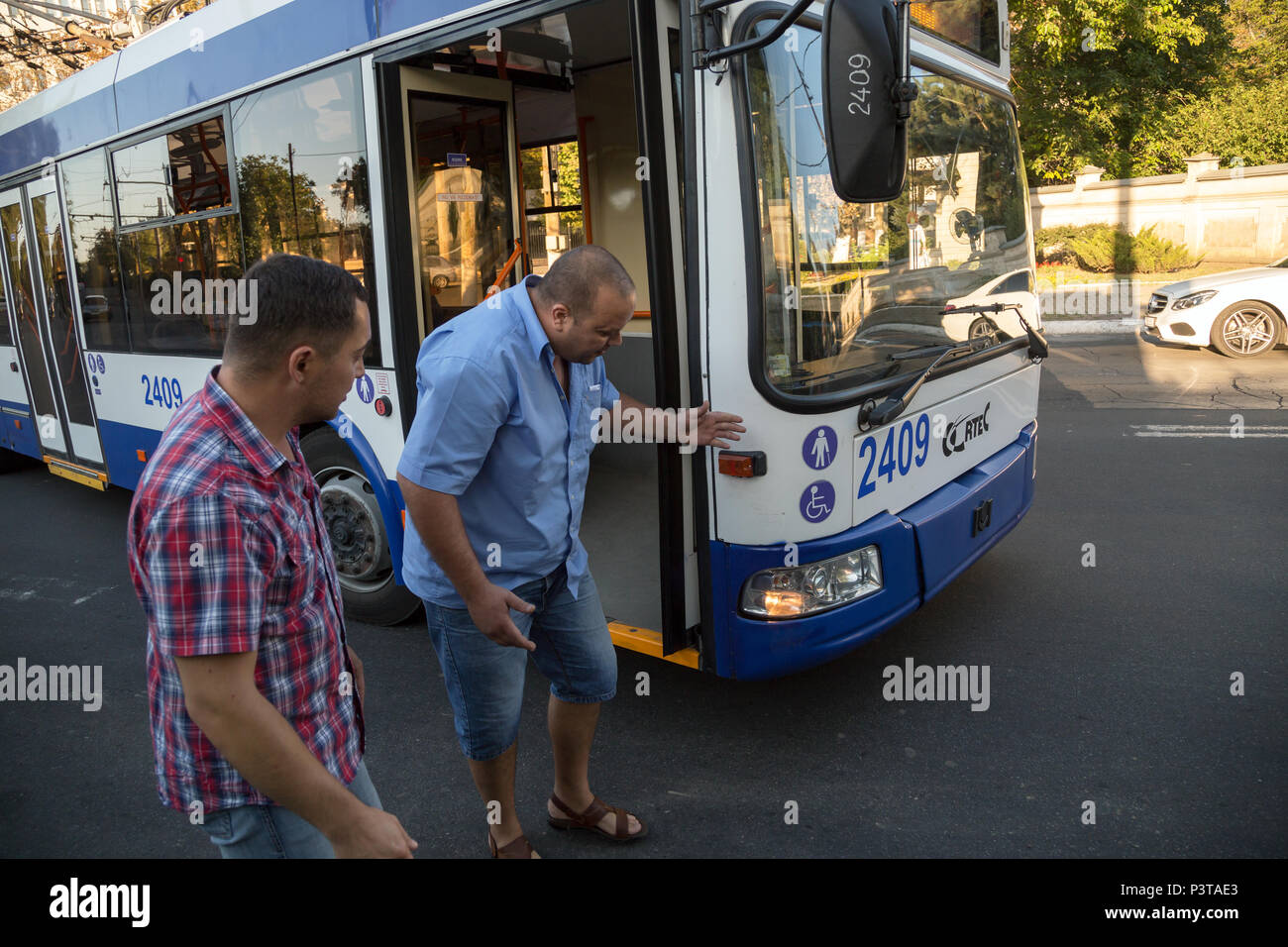 Republic of Moldova, Chisinau - Bus driver complains a scratch on his bus  Stock Photo - Alamy