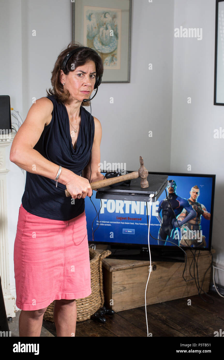 Mother About To Take Extreme Measure Of Smashing Gaming Console With - mother about to take extreme measure of smashing gaming console with a hammer after children became addicted to fortnite survival game