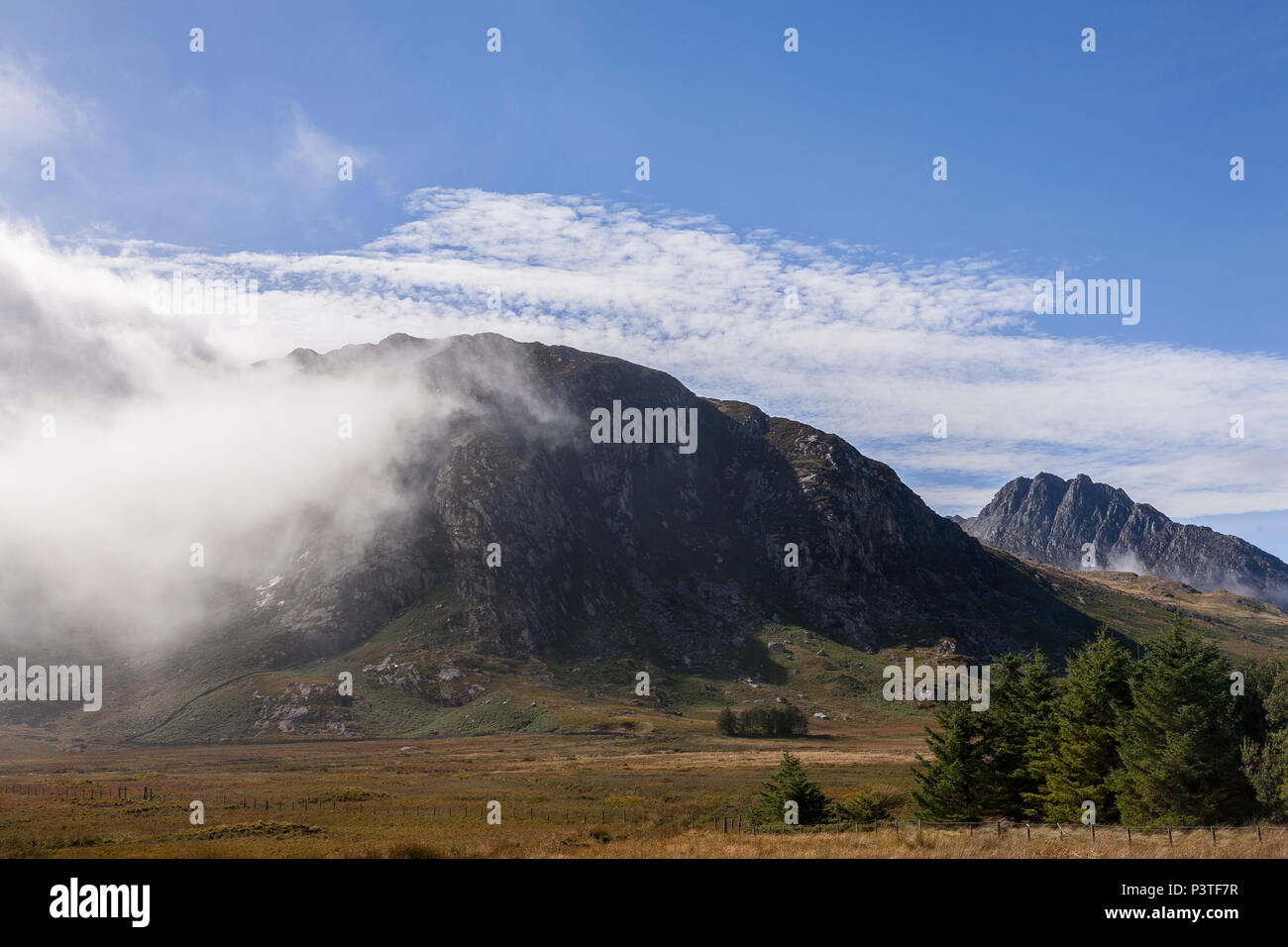 Mist in sunshine over the Glyderau mountains, Snowdonia, North Wales Stock Photo