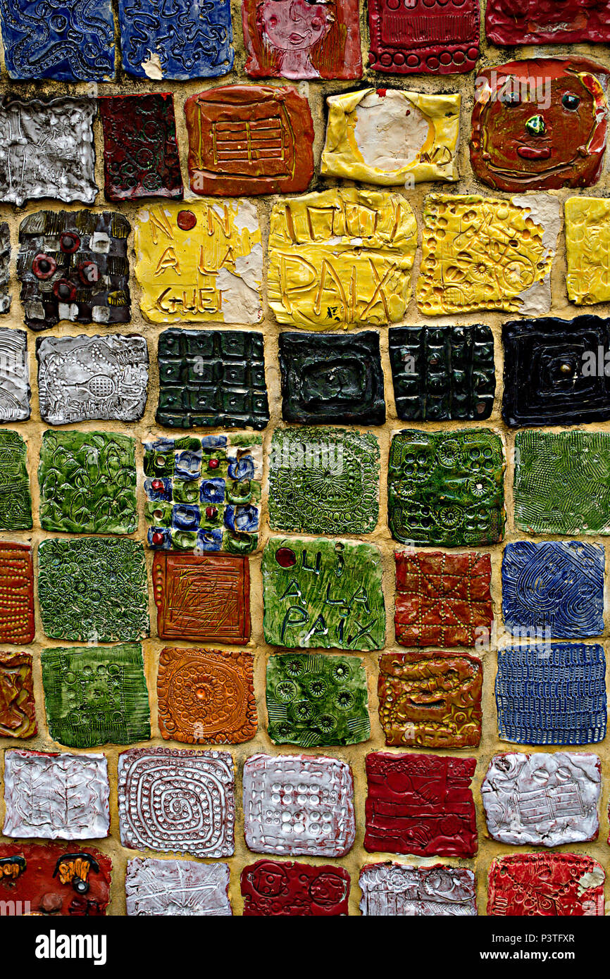 Mosiac of handmade ceramic tiles of various colours and designs at Evreux, Normandy, France Stock Photo