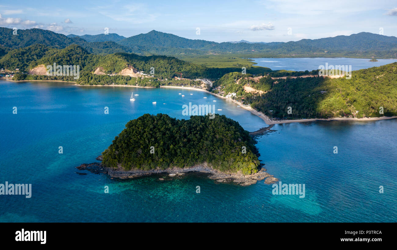 Aerial drone view of a beautiful tropical landscape with towering limestone islands in the ocean Stock Photo