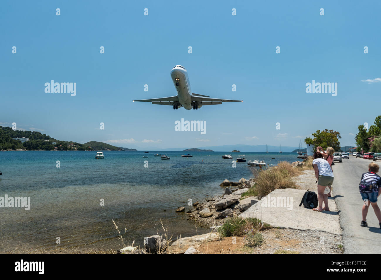 Passenger plane landing on Skiathos island Greece. Stock Photo