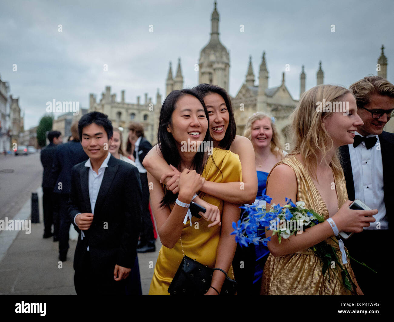 Cambridge, UK. 19th June, 2018. Trinity College Cambridge May Ball. Cambridge University students walk the streets of Cambridge after attending the Trinity College May Ball.  Picture by Andrew Parsons / Parsons Media Credit: andrew parsons/Alamy Live News Stock Photo