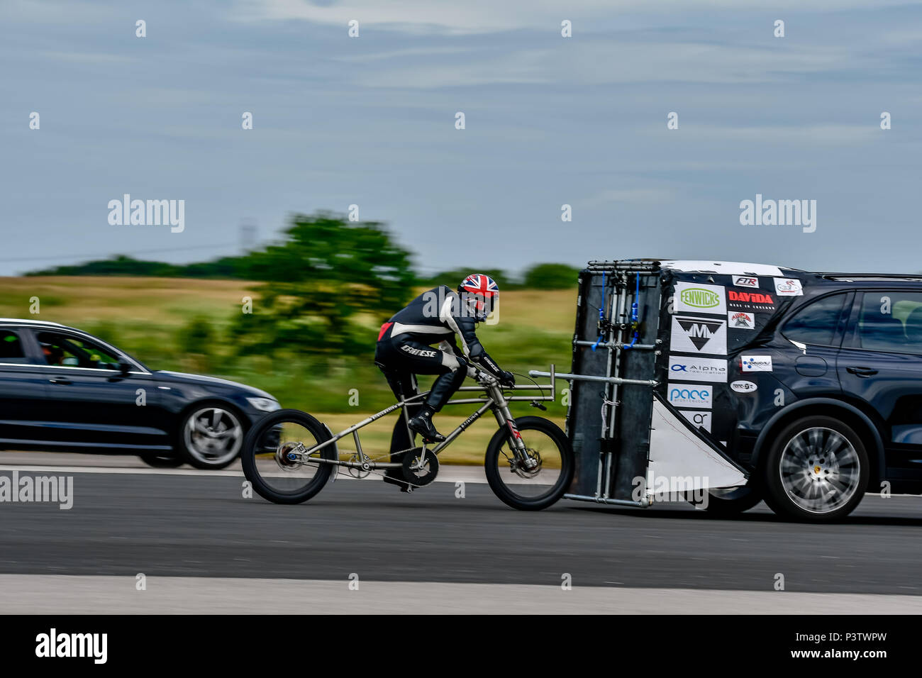 Elvington Airfield, Yorkshire, UK. 19th Jun, 2018. Neil Campbell sets European top speed record on self propelled bicycle riding at 135.3mph at Elvington Straightliners top speed event 19th June 2018 Credit: Mark Burn/Alamy Live News Stock Photo