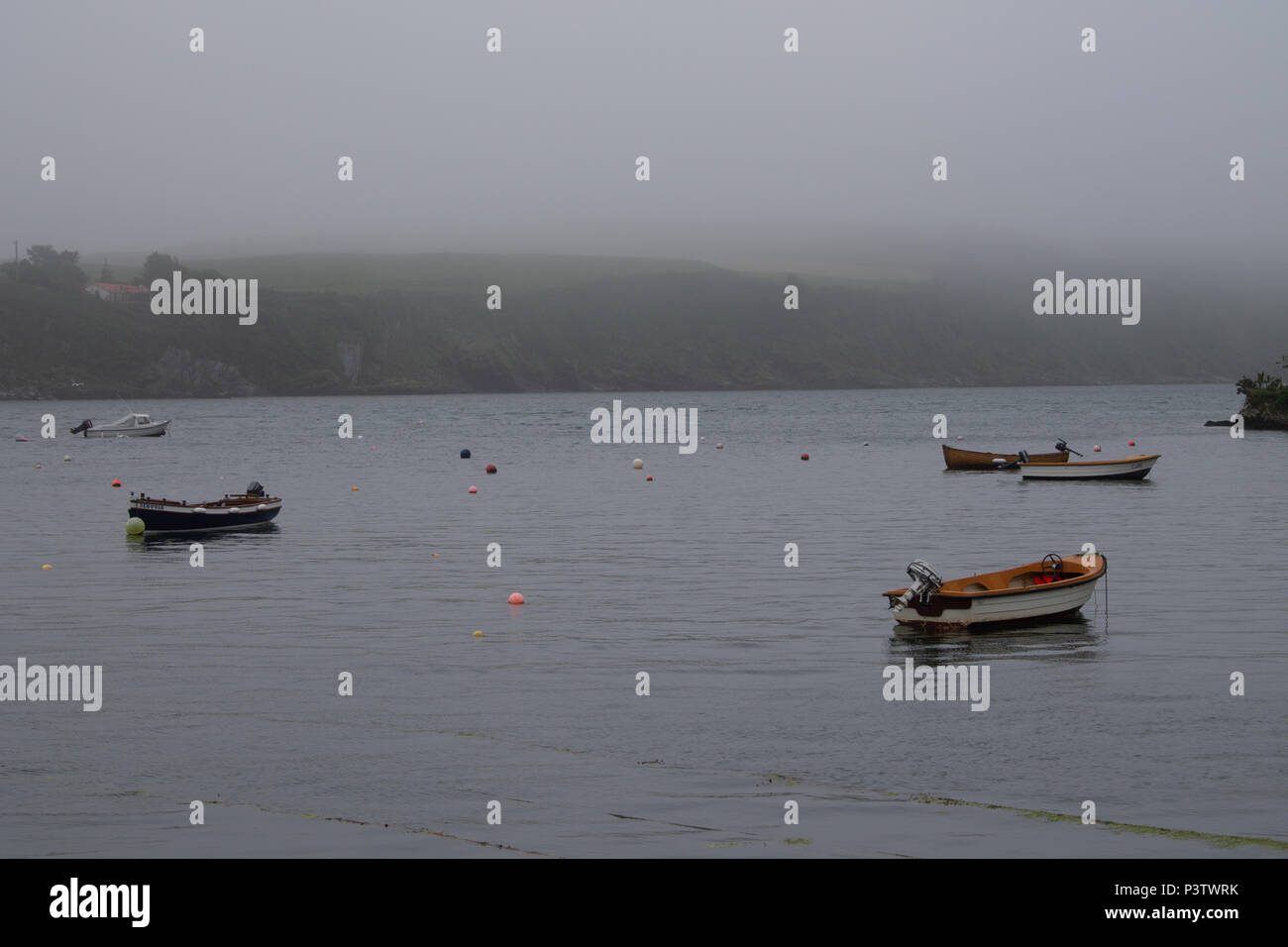 West Cork, Ireland. 19th June, 2018. A grey humid start to the day, with low cloud and mist covering the hilltops nearly down to sea level, with a promise of brighter weather later when the cloud starts to break up. Credit: aphperspective/Alamy Live News Stock Photo