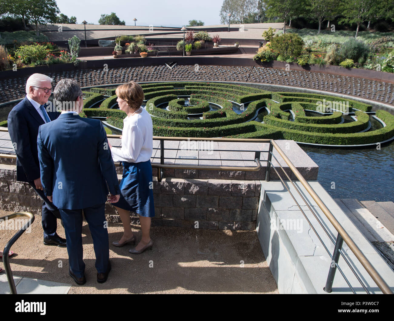 19 June 2018, USA, Los Angeles (California): German President Frank-Walter Steinmeier and his wife Elke Buedenbender, are guided through the complex and the garden of the Getty Museum by the deputy director of the Getty Research Institute, Andrew Perchuk (C). President Steinmeier and his wife are on a three day visit to California. Photo: Bernd von Jutrczenka/dpa Stock Photo