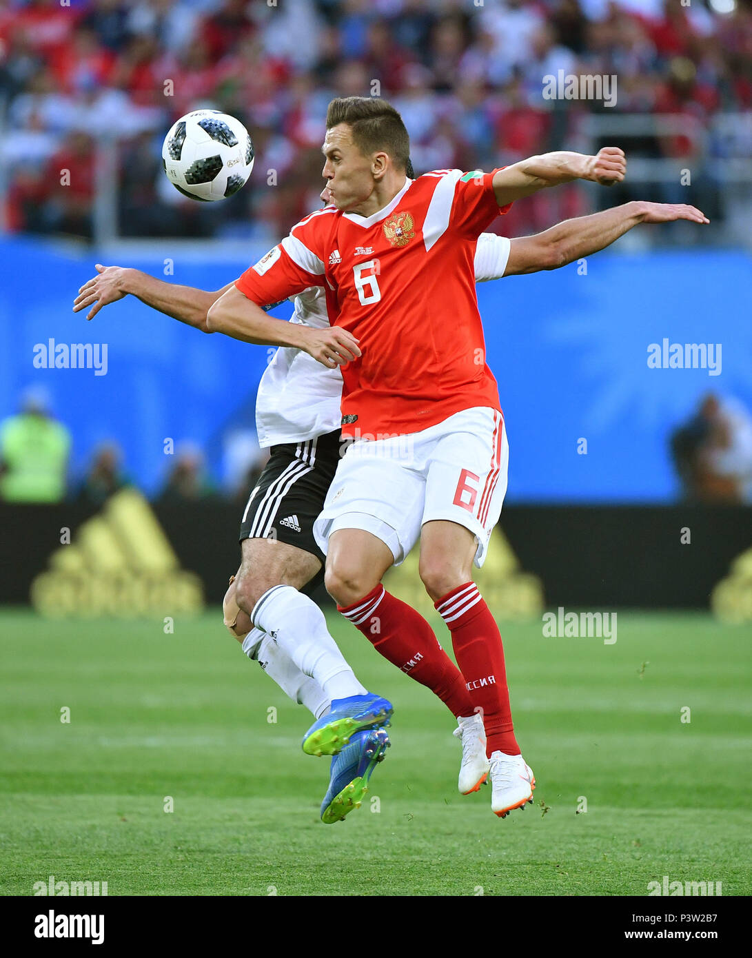 Saint Petersburg, Russia. 19th June, 2018. Denis Cheryshev (front) of Russia competes during a Group A match between Russia and Egypt at the 2018 FIFA World Cup in Saint Petersburg, Russia, June 19, 2018. Credit: Li Ga/Xinhua/Alamy Live News Stock Photo