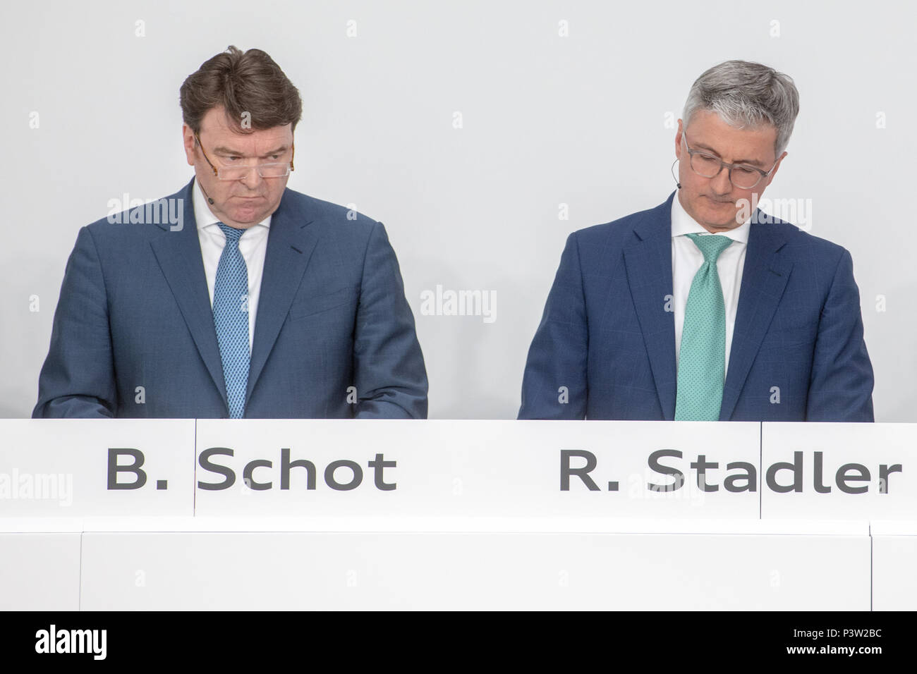 Ingolstadt, Germany. 15th Mar, 2018. Bram Schot (L), Audi sales director, sits next to Rupert Stadler, now suspended CEO of automobile manufacturer Audi AG, during the financial statement press conference. Audi sales director Schot takes over the directorial position temporarily at the car manufacturer on 19 June 2018. Credit: Armin Weigel/dpa/Alamy Live News Stock Photo