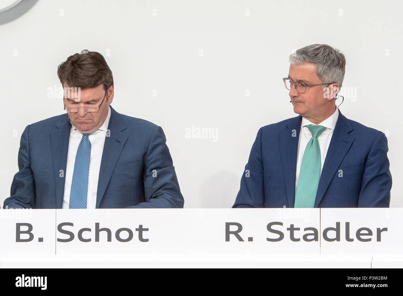 Ingolstadt, Germany. 15th Mar, 2018. Bram Schot (L), Audi sales director, sits next to Rupert Stadler, now suspended CEO of automobile manufacturer Audi AG, during the financial statement press conference. Audi sales director Schot takes over the directorial position temporarily at the car manufacturer on 19 June 2018. Credit: Armin Weigel/dpa/Alamy Live News Stock Photo