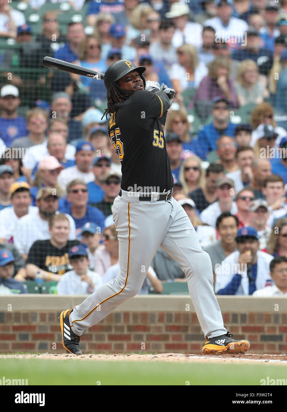 Pittsburgh Pirates first baseman Josh Bell (55) leaps for a high toss from  starting pitcher Chris Archer after fielding a ball hit by Cincinnati Reds'  Yasiel Puig (66) in the third inning