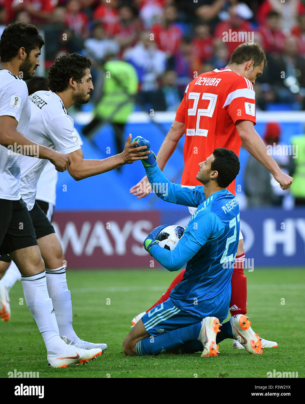 Saint Petersburg, Russia. 19th June, 2018. Goalkeeper Mohamed Elshenawy (R bottom) of Egypt claps with teammate Ahmed Hegazy (2nd L) during a Group A match between Russia and Egypt at the 2018 FIFA World Cup in Saint Petersburg, Russia, June 19, 2018. Credit: Li Ga/Xinhua/Alamy Live News Stock Photo