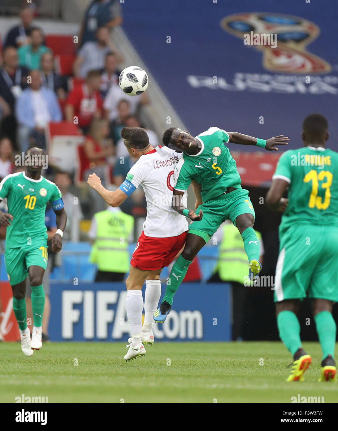 Moscow, Russia. 19th June, 2018. Idrissa Gana Gueye (2nd R) of Senegal competes for a header with Robert Lewandowski (2nd L) of Poland during a Group H match between Poland and Senegal at the 2018 FIFA World Cup in Moscow, Russia, June 19, 2018. Senegal won 2-1. Credit: Fei Maohua/Xinhua/Alamy Live News Stock Photo