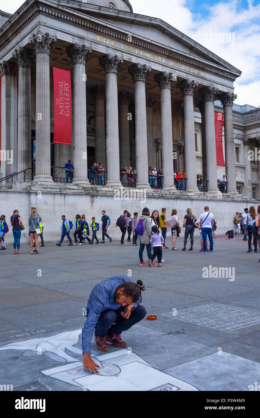 London, UK. 19th June 2018. Joseph, a pavement artist from Slovakia draws a dedication to his Grandmother who passed away in March 2018. He is one of many pavement artists in front of the National Gallery on a sunny afternoon. ©TimRing/Alamy Live News Stock Photo