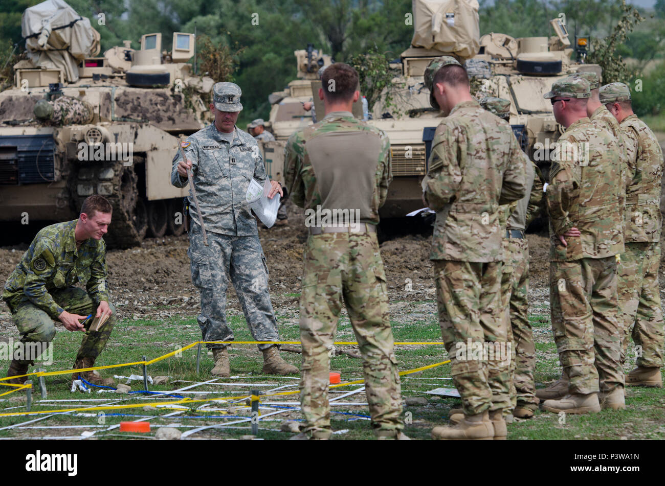 us-army-capt-allan-whitehead-commander-of-company-c-2nd-battalion-116th-cavalry-brigade-combat-team-briefs-the-plan-for-his-teams-training-exercise-during-saber-guardian-2016-at-the-romanian-land-forces-combat-training-center-in-cincu-romania-july-30-saber-guardian-2016-is-a-multinational-military-exercise-involving-approximately-2800-military-personnel-from-ten-nations-including-armenia-azerbaijan-bulgaria-canada-georgia-moldova-poland-romania-ukraine-and-the-us-the-objectives-of-this-exercise-are-to-build-multinational-regional-and-joint-partnership-capacity-by-enhancin-P3WA1N.jpg