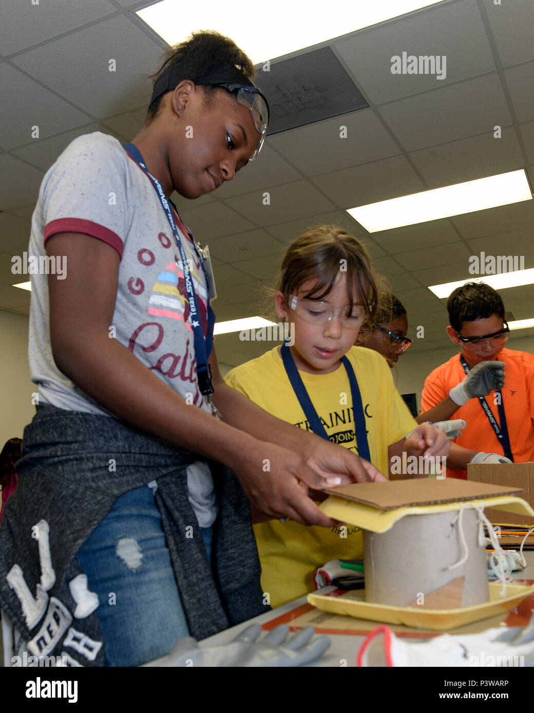 STARBASE Houston students glue pieces together to build a birdhouse ...