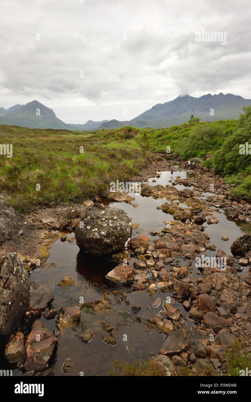 The dried up riverbed of Allt Dubh leading to Sligachan and the Cuillin mountains in Skye, Scotland, UK Stock Photo