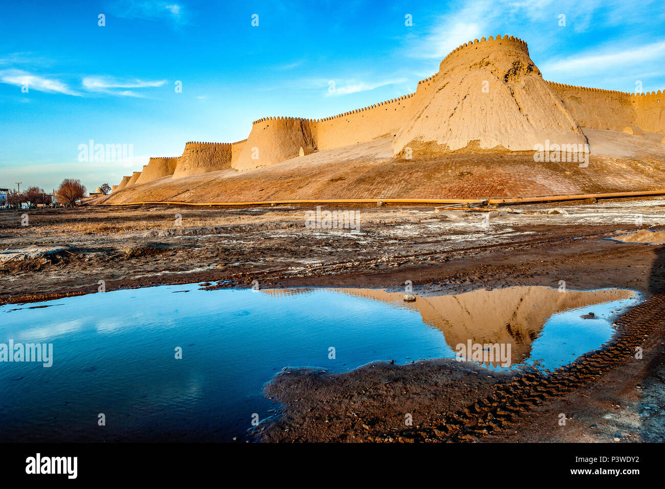 The corner south west of the walls of Khiva at sunset Stock Photo