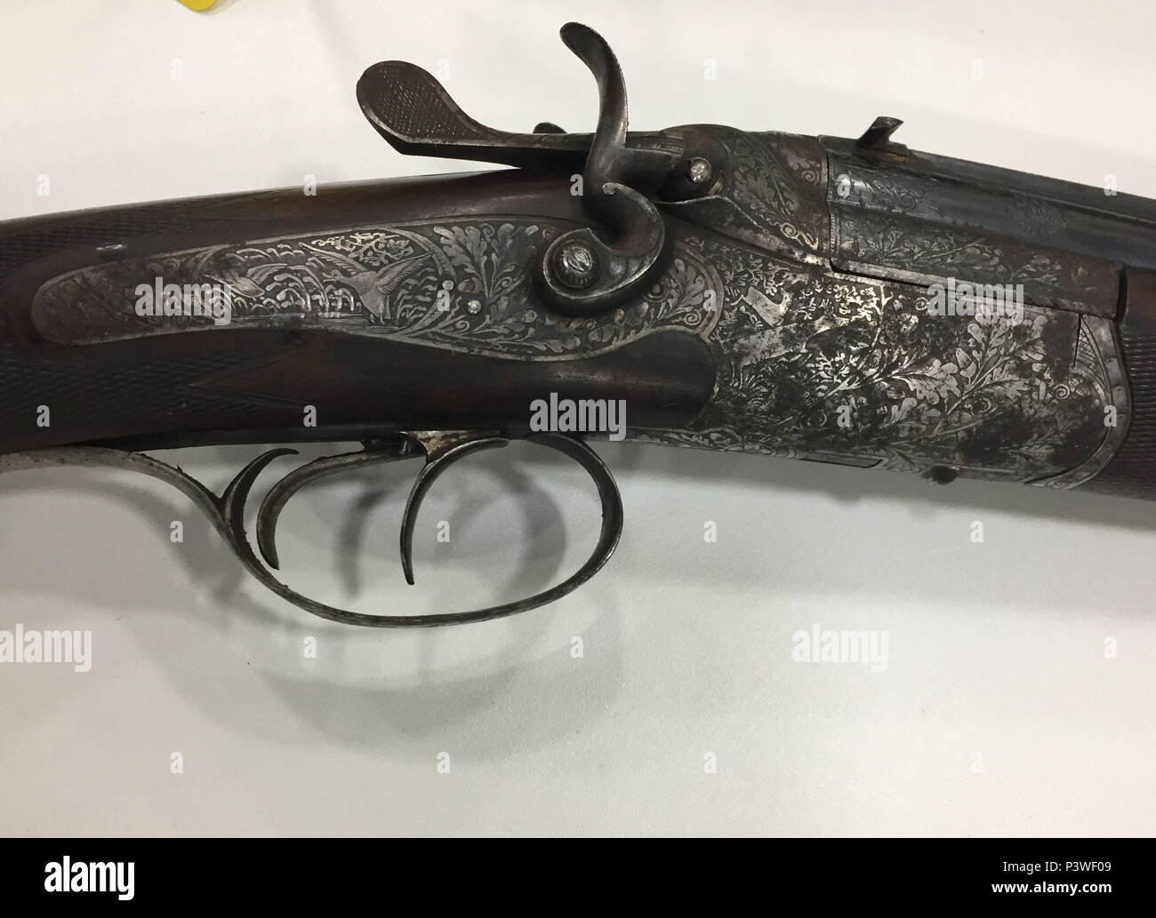 Exquisitely detailed metalwork and engraving on the trigger mechanisms of a hunting shotgun which was among weaponry handed in during a West Midlands Police firearms surrender. In all there were 116 seizures, including 36 lethal or convertible firearms. Stock Photo