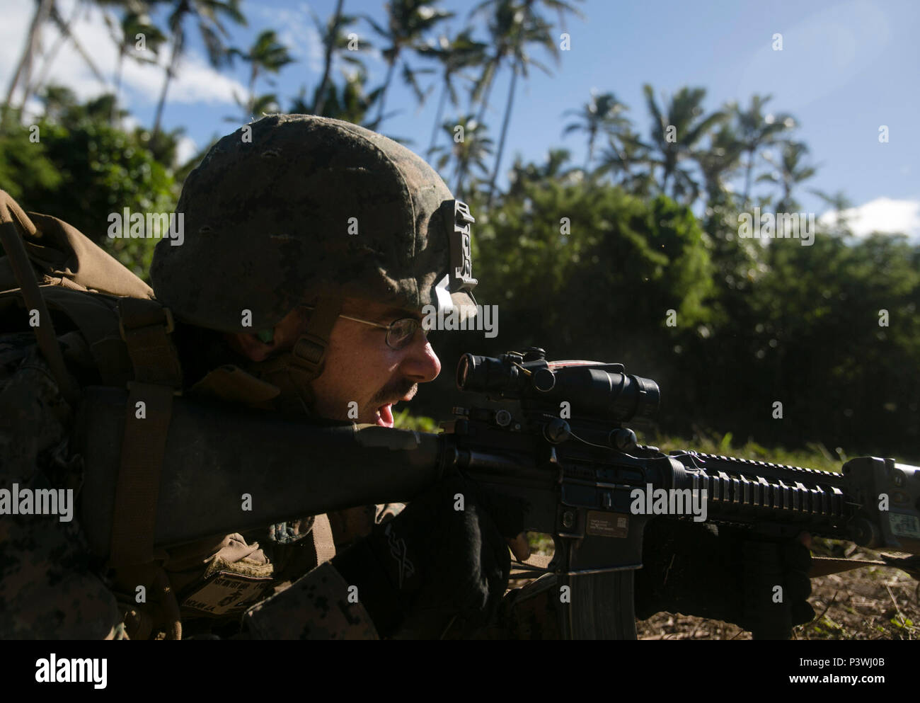 MOTUTAPU ISLAND, Tonga — Lance Cpl. Jake A. Nolan shouts commands as a fire-team leader during a live-fire range, July 27, 2016, on Motutapu Island, Tonga, as part of a multi-national, bilateral exercise, between U.S. and Tongan forces, designed to increase interoperability and relations. The service members combined and applied skills practiced during the exercise in a culminating range such as demolition, high explosive exploitation, beach insertion and buddy rushing. Nolan, from Concord, North Carolina, is an infantryman with Task Force Koa Moana and is originally assigned to Company A, 1st Stock Photo