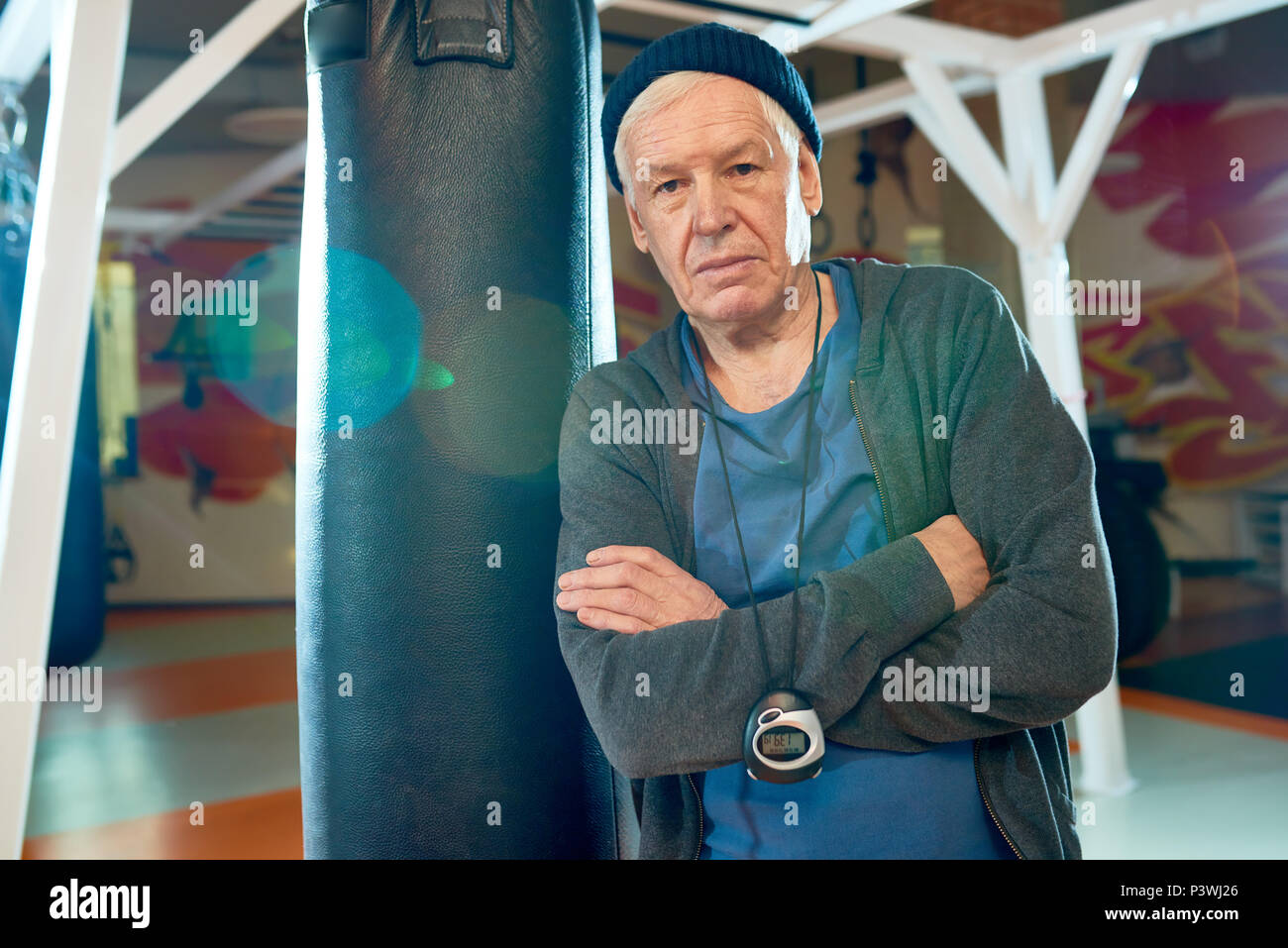 Professional trainer in boxing gym Stock Photo
