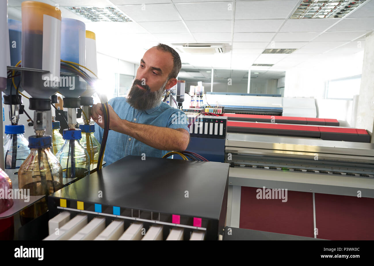 Plotter printing wide format large banner hi-res stock photography and ...