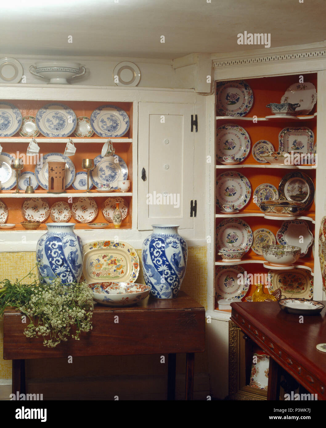 Tall Blue White Vases On Table In Cottage Dining Room With