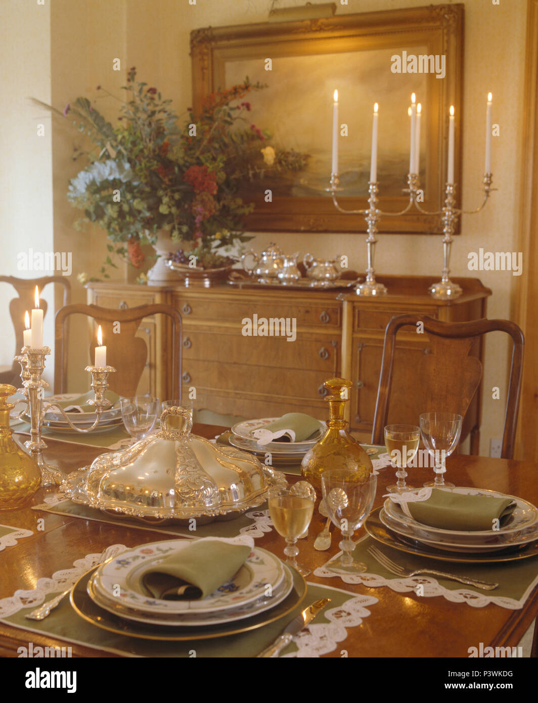 Antique Glassware And Silver Tureen On Table Set For Lunch In Country Dining Room With Silver Candlesticks On Sideboard Antique Glassware And Silver Tureen On Table Set For Lunch In Country Dining Room With Silver Candlesticks On Sideboard