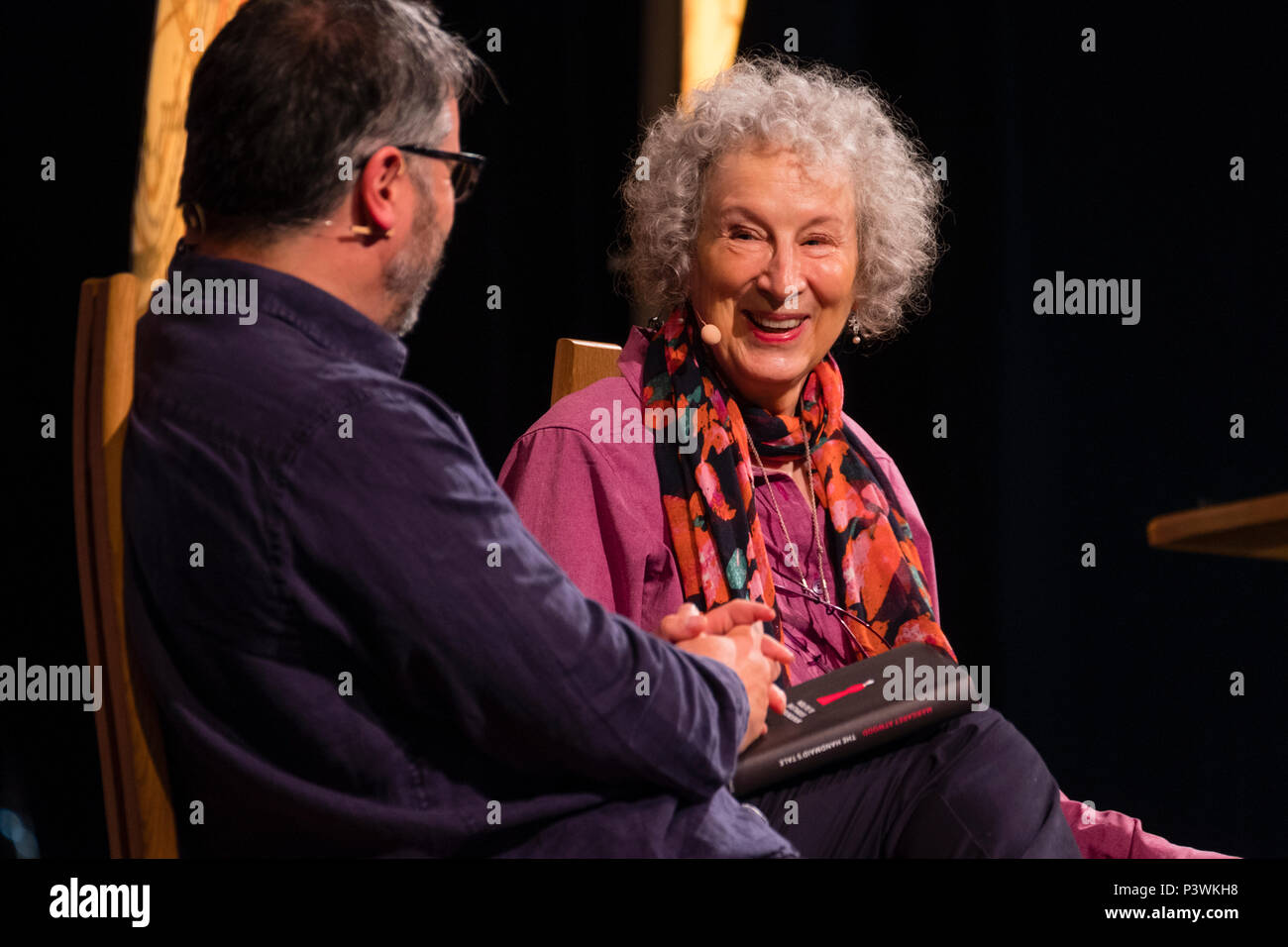 Margaret Atwood, acclaimed Canadian poet, novelist, literary critic, essayist, inventor, teacher and environmental activist.  Pictured talking to Peter Florence, Festival director, at the 2018 Hay Festival of Literature and the Arts.  The annual festival  in the small town of Hay on Wye on the Welsh borders , attracts  writers and thinkers from across the globe for 10 days of celebrations of the best of the written word, political though  and literary debate Stock Photo