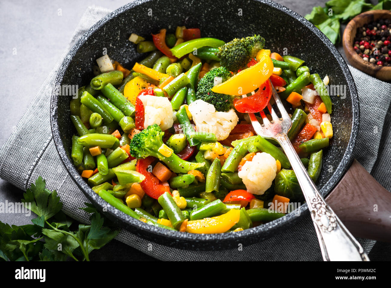 Stir fry vegetables in the wok. Healthy vegan food. Lowcalorie dish