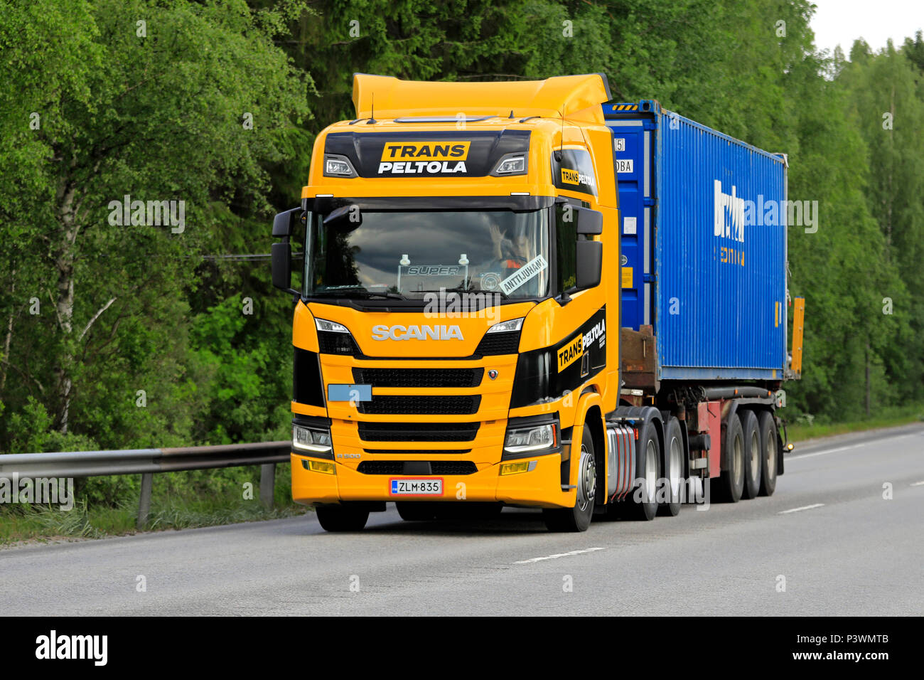 Next Generation Scania R500 truck of Trans-Peltola hauls Bruhn bulk container along highway in the summer. Jyvaskyla, Finland - June 15, 2018. Stock Photo
