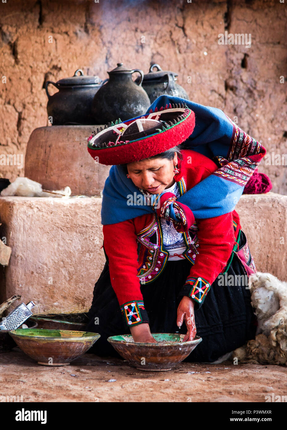 Peruvian woman colouring wool Stock Photo