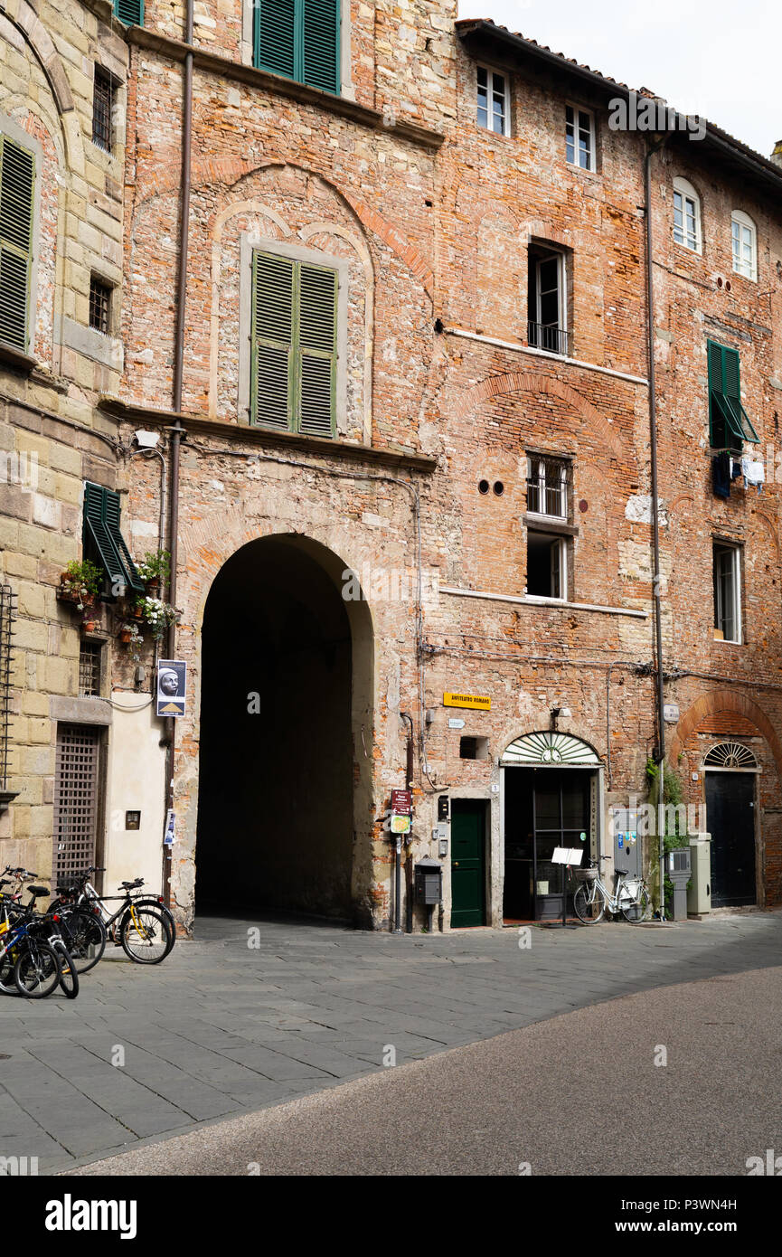 Piazza dell'Anfiteatro, exterior view showing an entrance to the Piazza Stock Photo