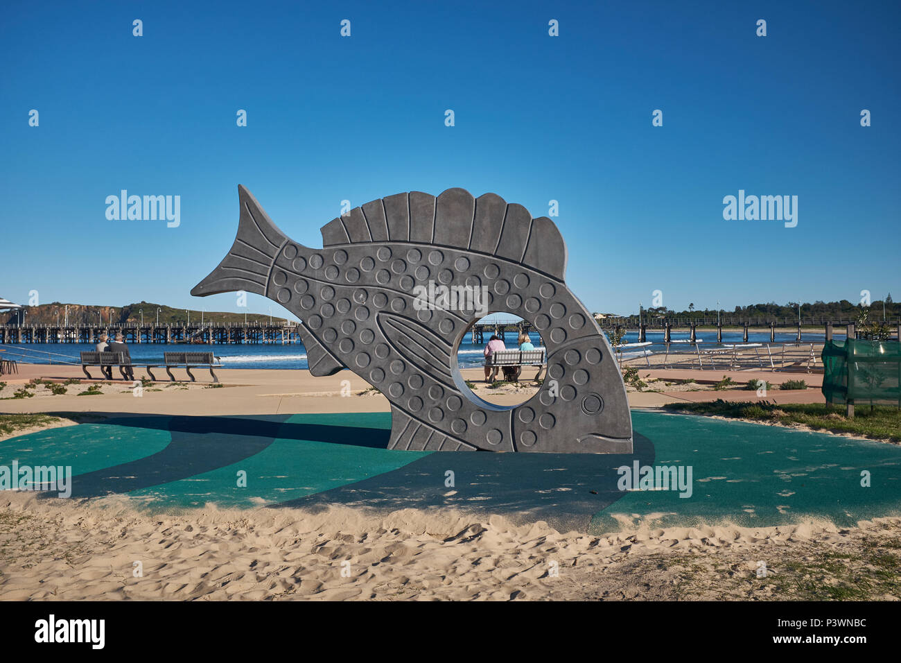 A large fish sculpture called Cruising made from concrete at Jetty Foreshores, Coffs Harbour, New South Wales, Australia Stock Photo