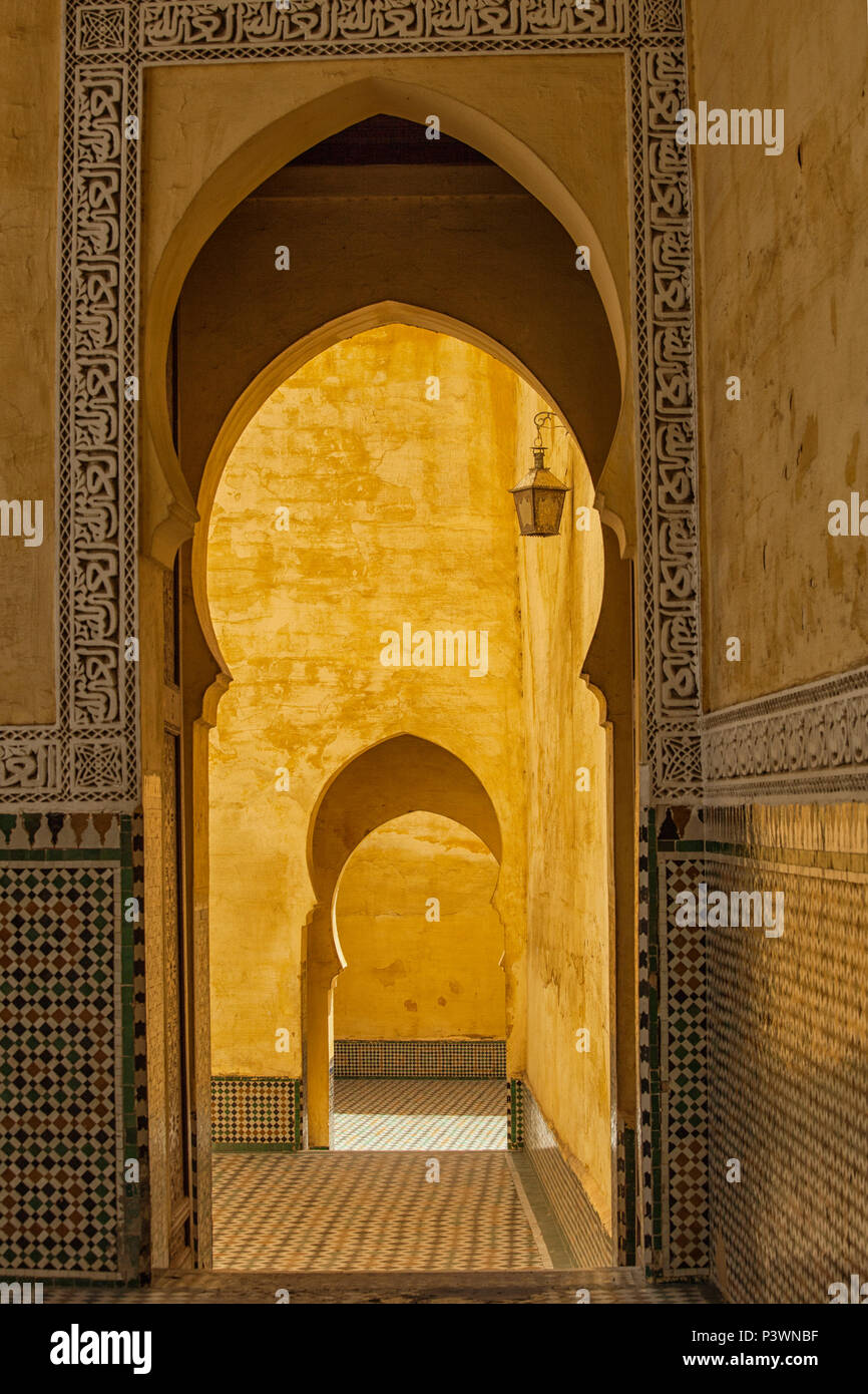 MEKNES, MOROCCO - MAY 5: Arabesque arch in the Moulay Ismail Mausoleum, the most visited tourist icon in Meknes - UNESCO World Heritage. On MAY 5, 201 Stock Photo