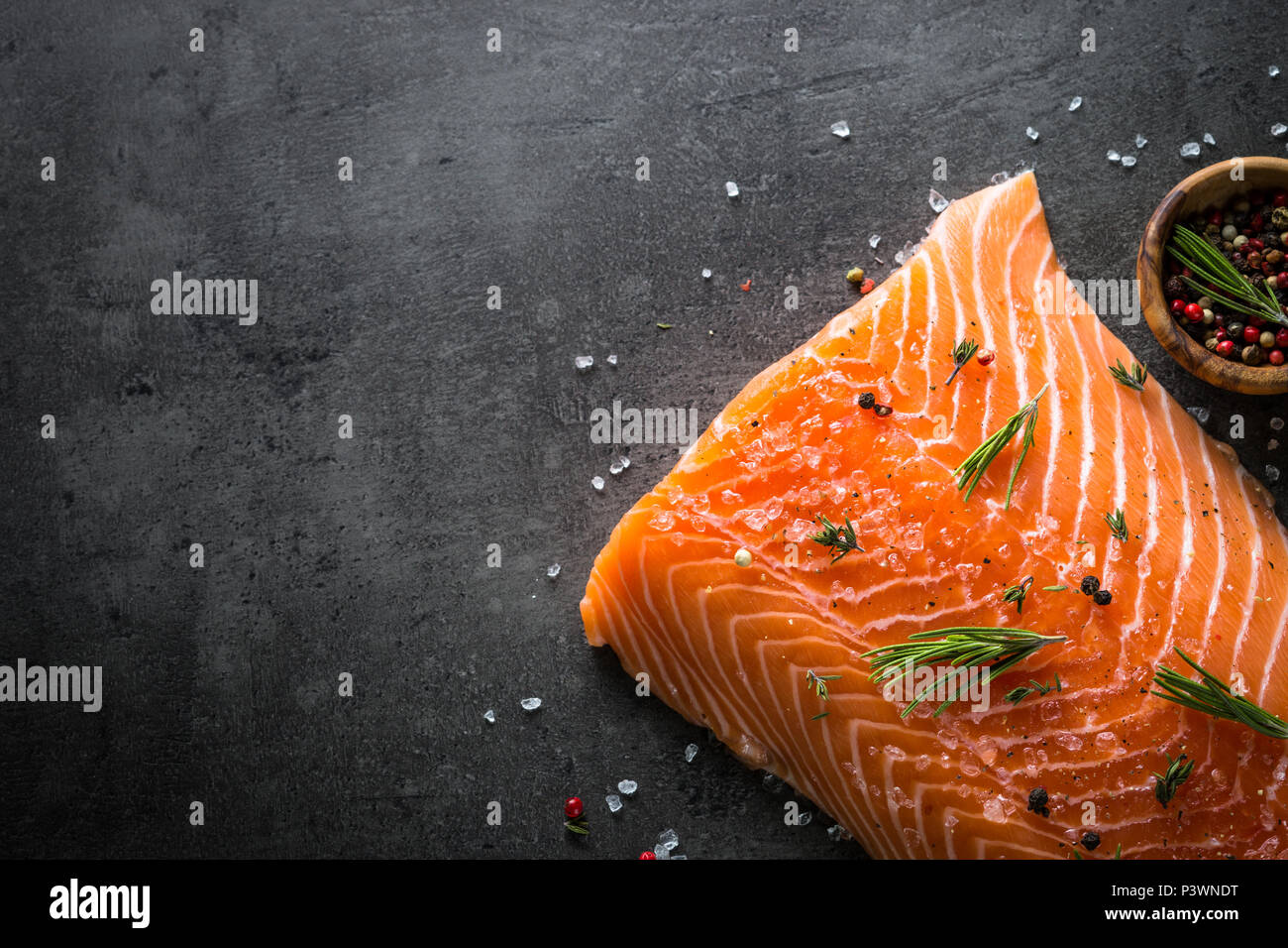 Fresh fish. Salmon uncooked fillet on black slate table. Top view Stock ...