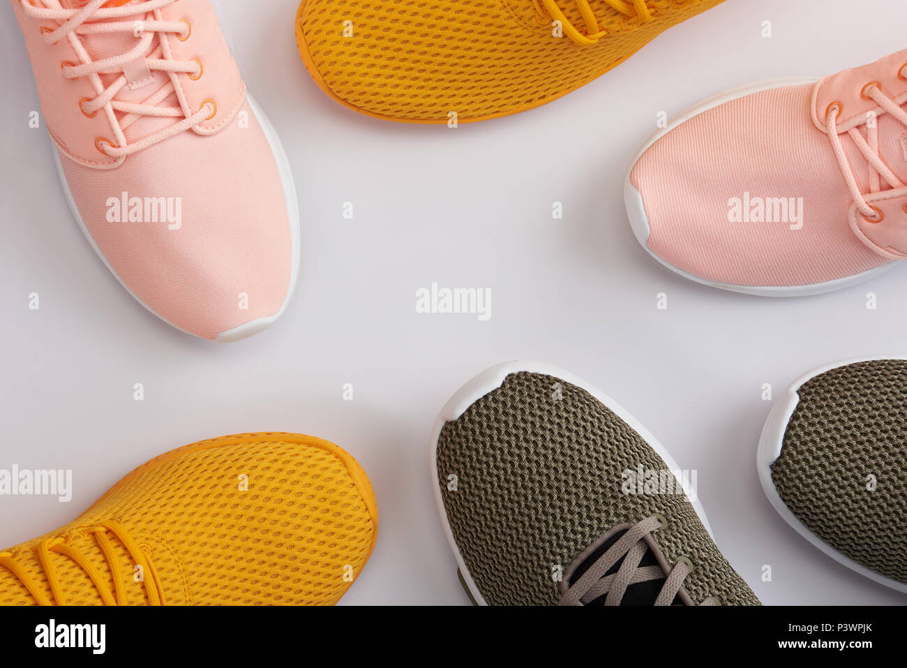 Pattern from colorful sport shoes on white background Stock Photo