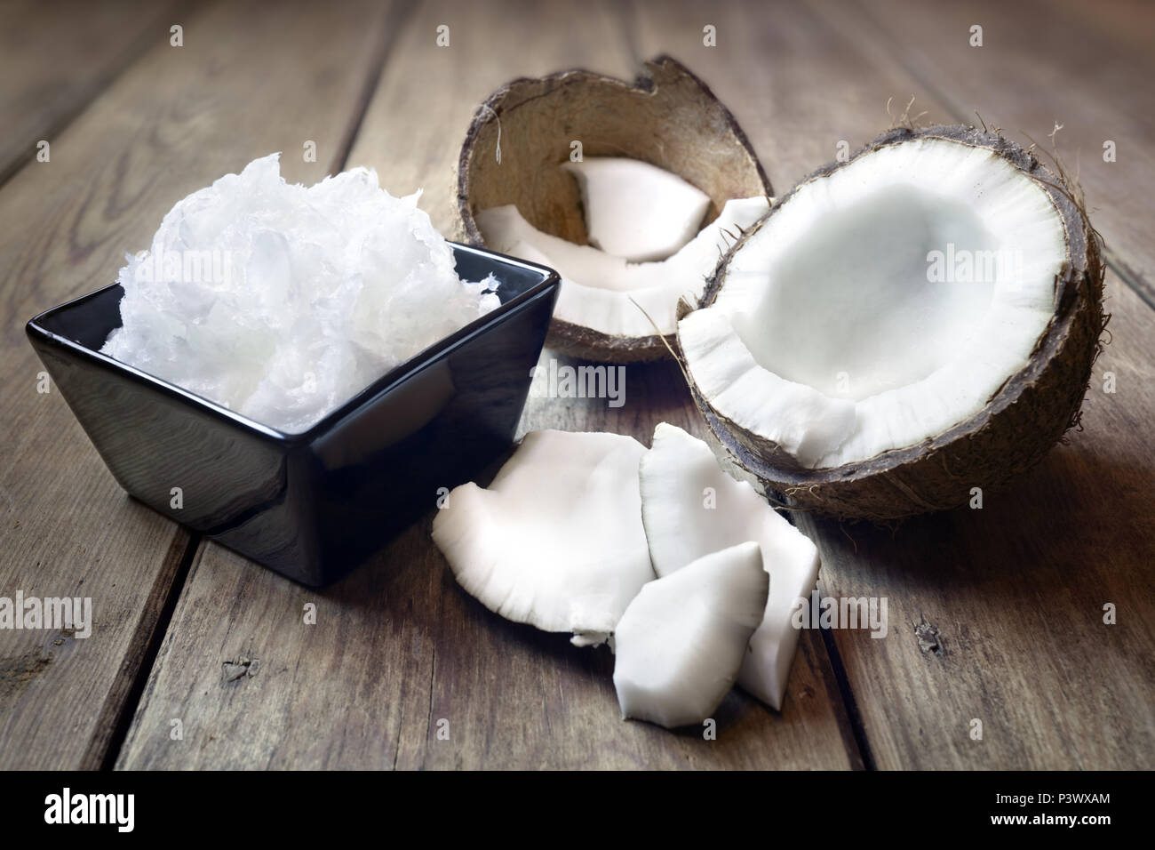 Fresh coconuts and coconut oil cooking ingredient or spa treatment Stock Photo