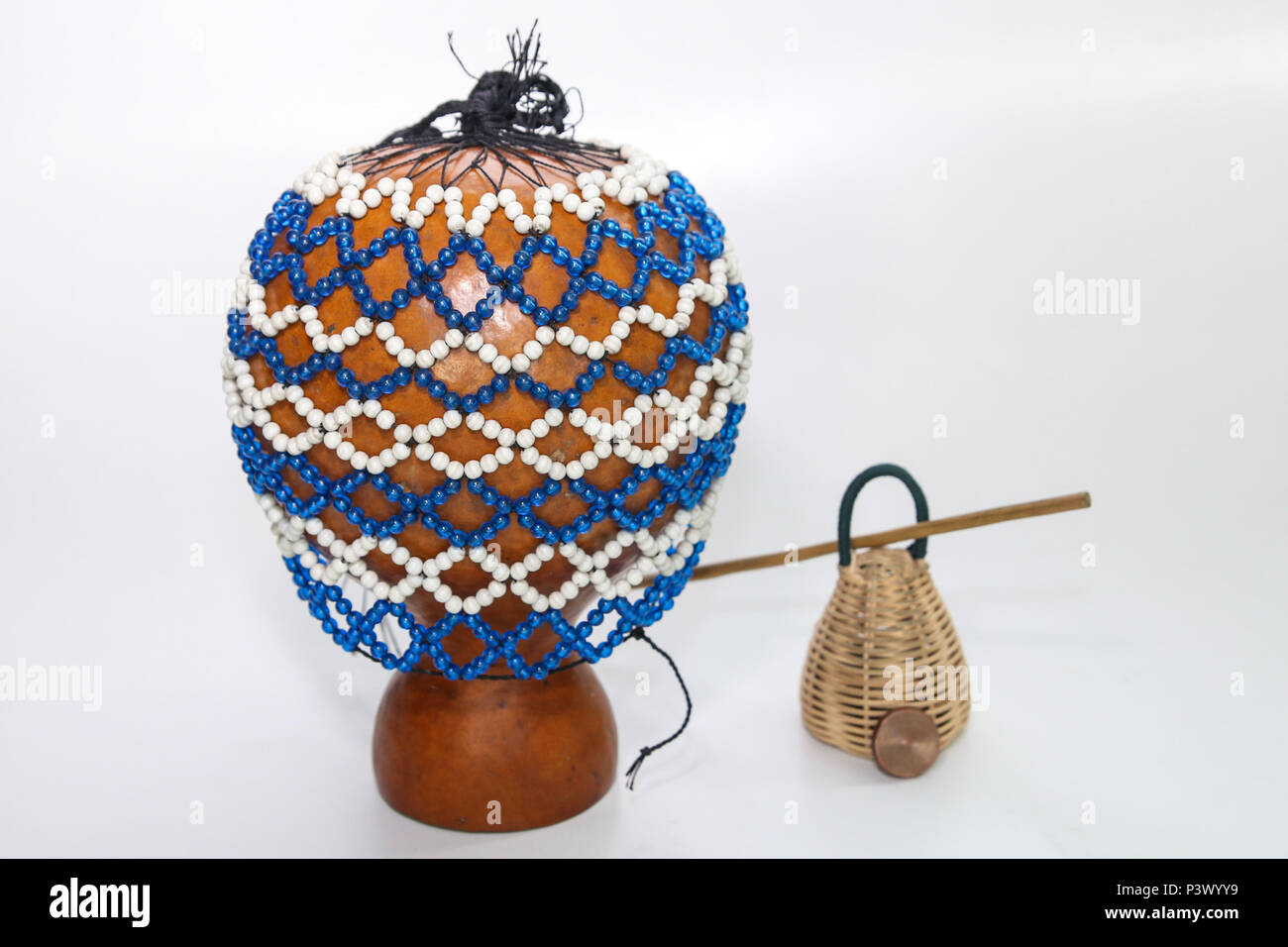 Na foto os instrumentos xequerê, caxixi, baqueta e dobrão, utilizados para tocar o berimbau. Stock Photo