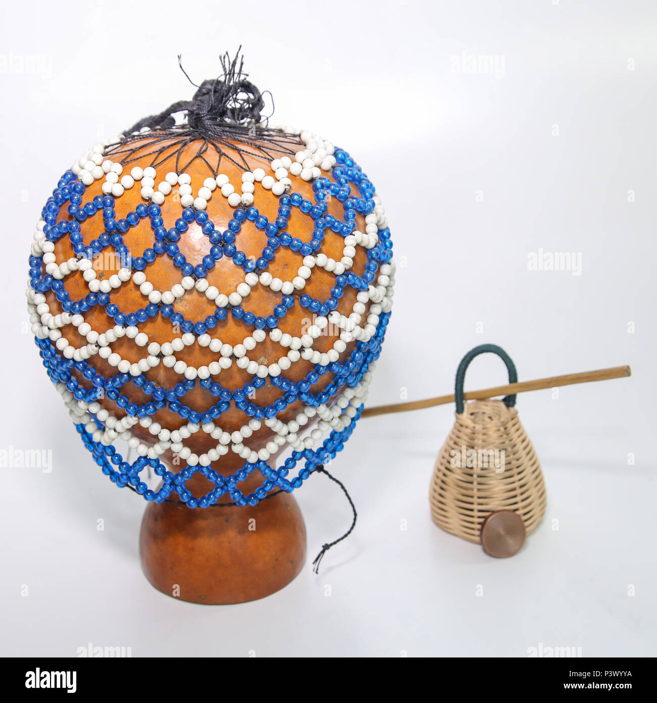 Na foto os instrumentos xequerê, caxixi, baqueta e dobrão, utilizados para tocar o berimbau. Stock Photo