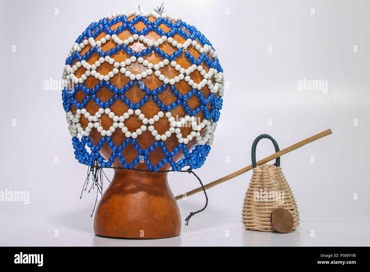 Na foto os instrumentos xequerê, caxixi, baqueta e dobrão, utilizados para tocar o berimbau. Stock Photo