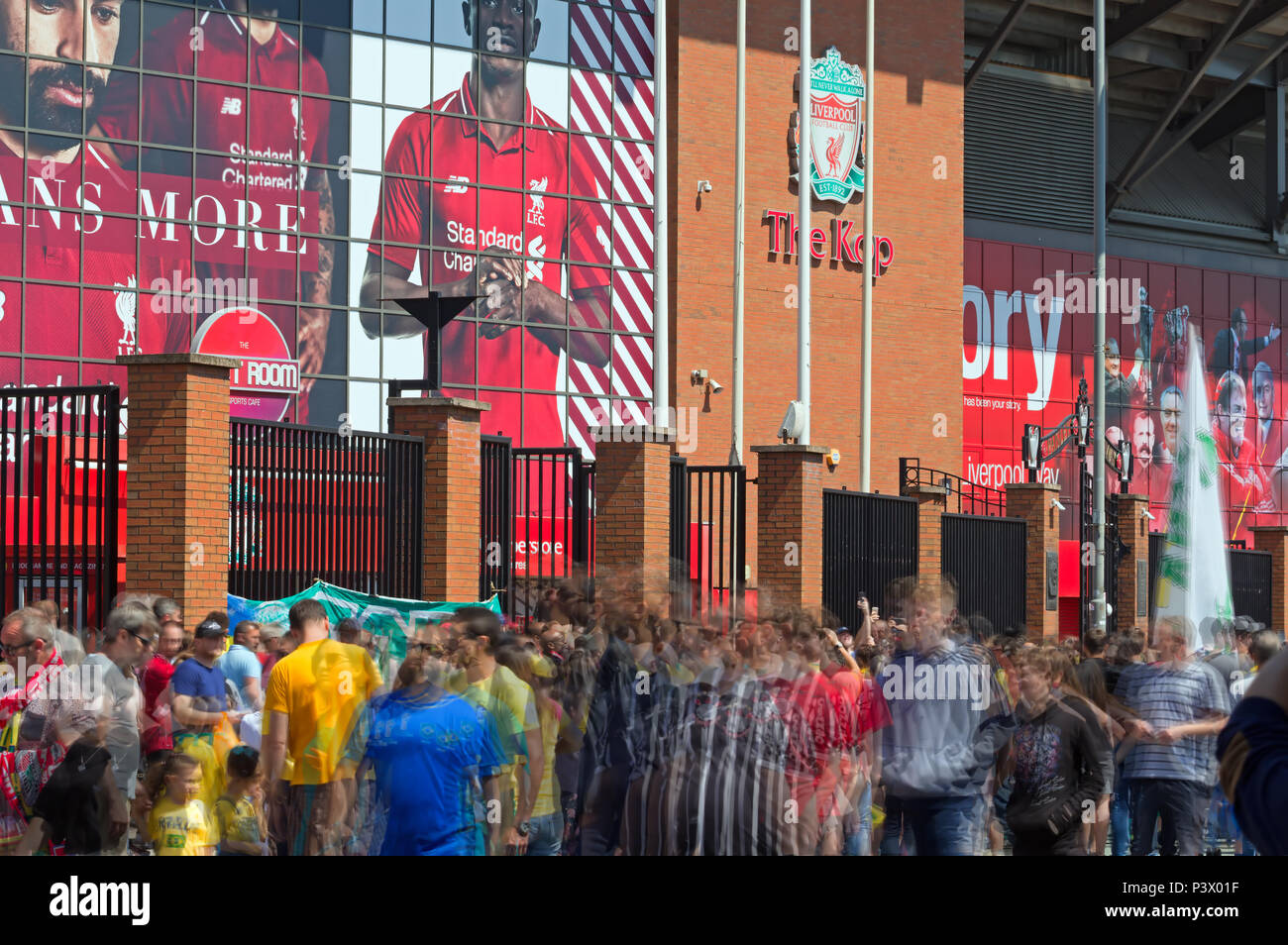 Multiple exposure image of football fans outside Anfield Liverpool for the friendly game between