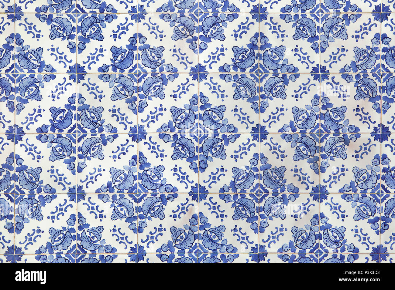 Traditional Portuguese azulejo tiles on the building in Porto, Portugal. Background texture. Stock Photo