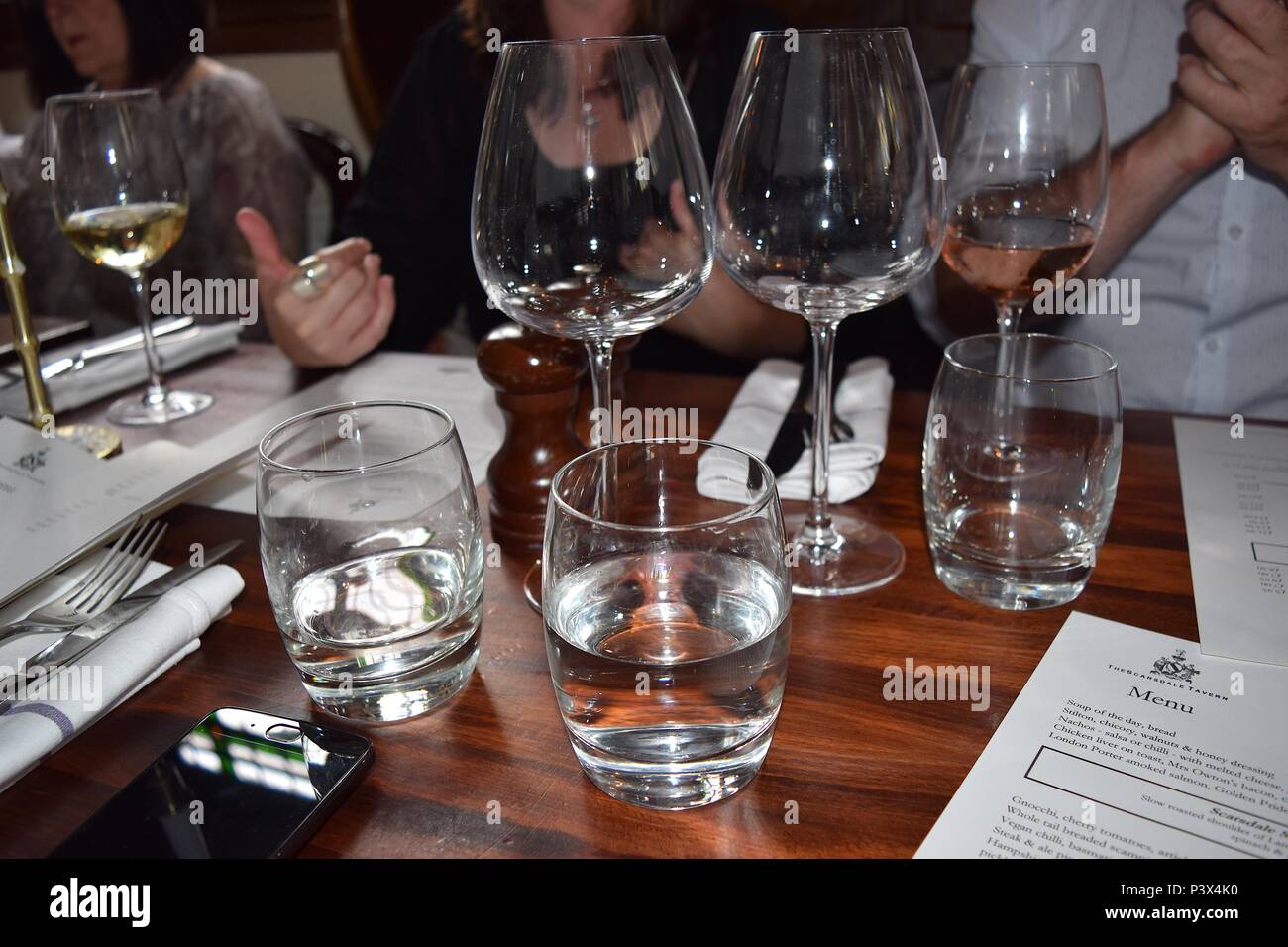 Wine glasses on a wooden bar in traditional English pub Stock Photo Alamy