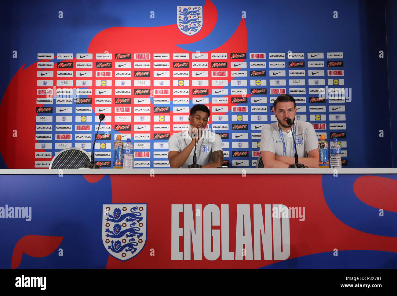 England's Marcus Rashford (left) and Senior Communications manager Andy Walker during the media access at Repino Cronwell Park, Repino. Stock Photo