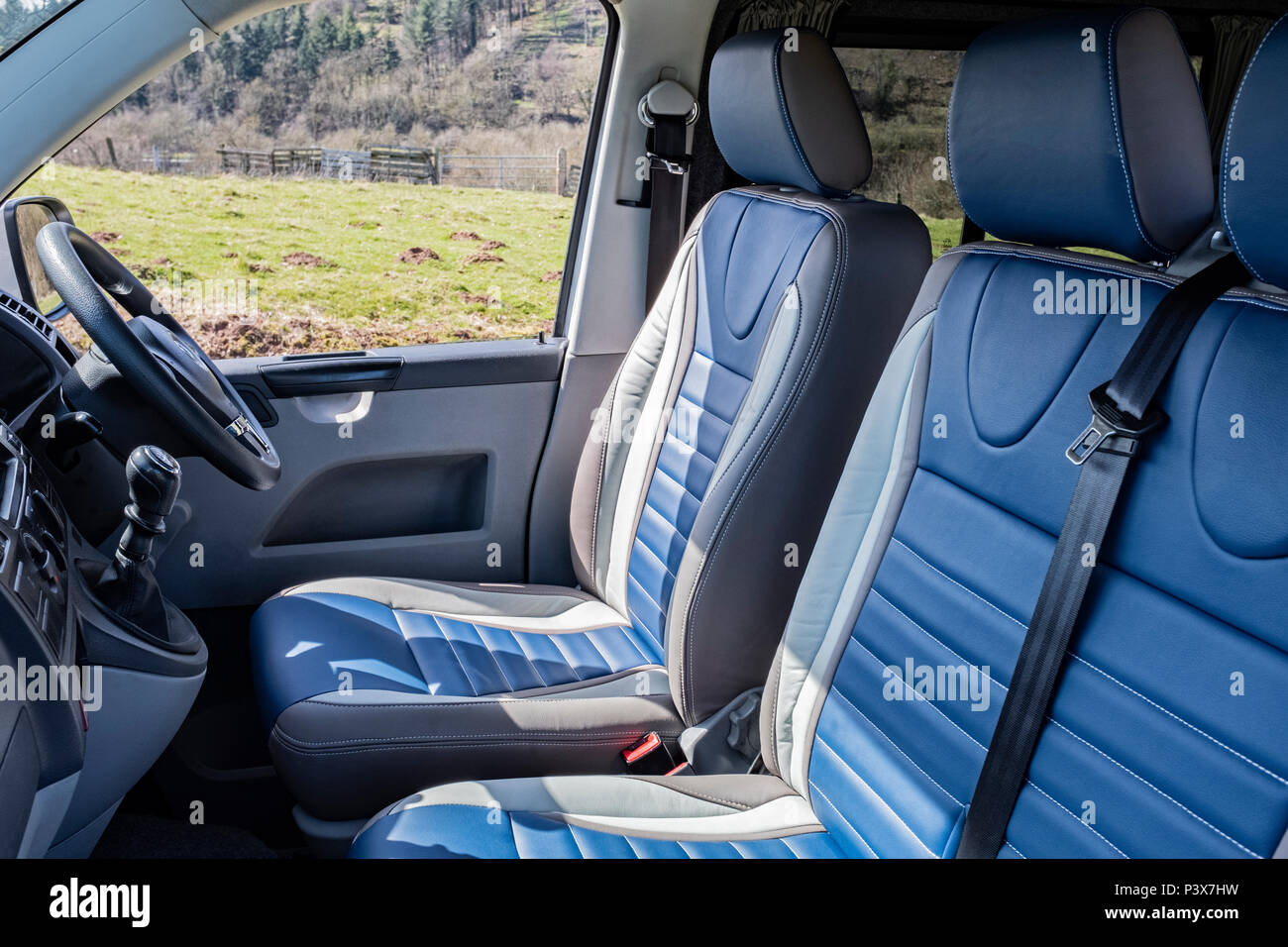 Leather seats in a custom Volkswagen T6 campervan. Stock Photo