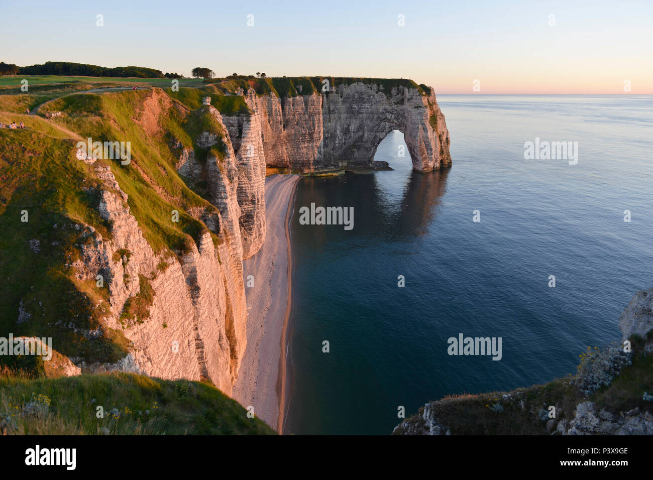 Etretat (northern France), town along the 'Cote d'Albatre' (Norman coast), in the area called 'pays de Caux'. The 'Manneporte' sea stack at nightfall Stock Photo