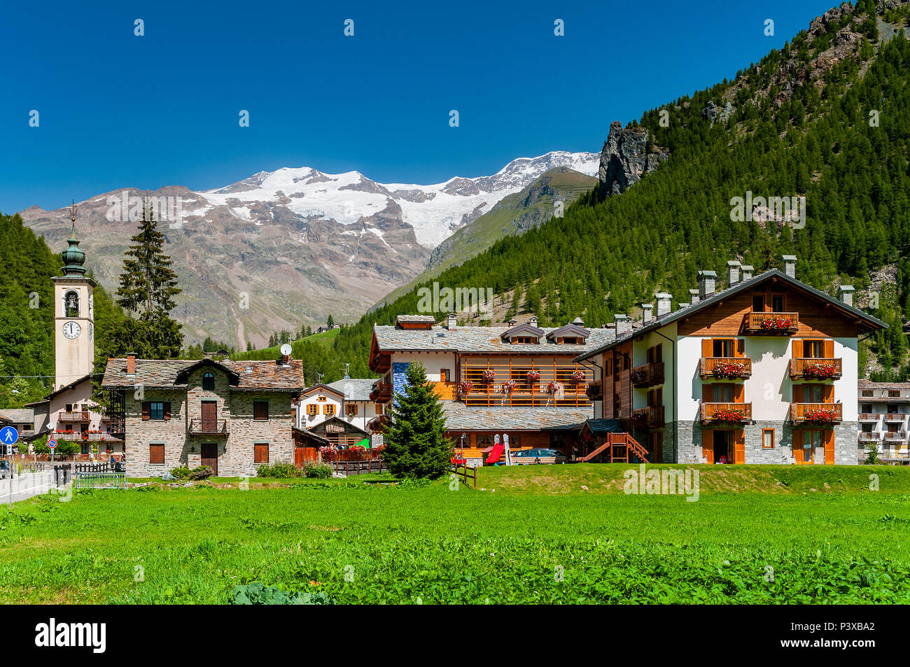 Summer view of Gressoney La Trinite, Aosta Valley, Italy with Monte Rosa in the background Stock Photo