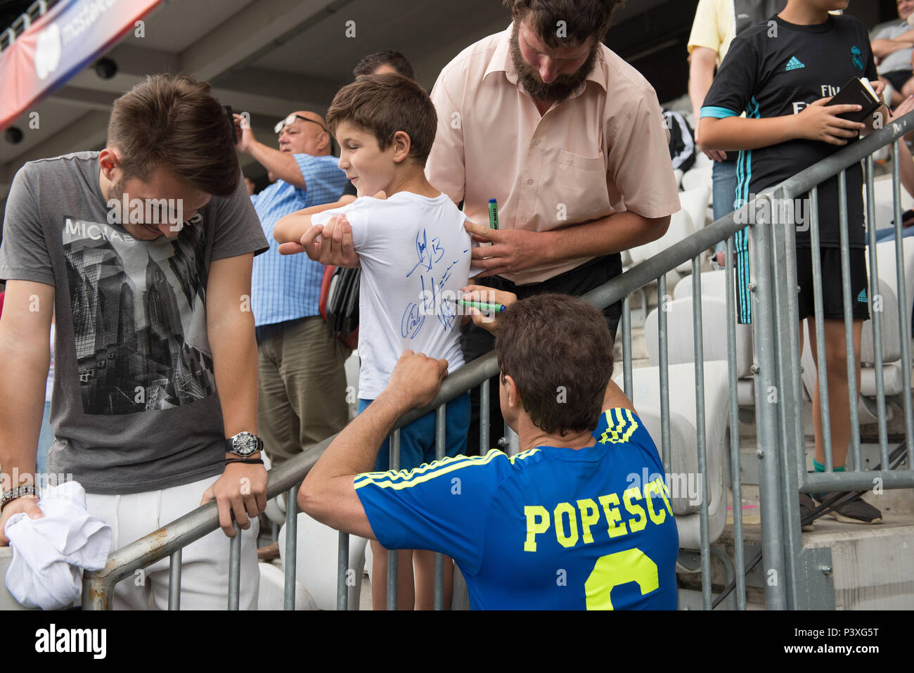 CLUJ NAPOCA, ROMANIA - JUNE 15, 2018: Romanian football player Gheorghe Popescu from the Golden Team signing autographs during a match against Barcelo Stock Photo