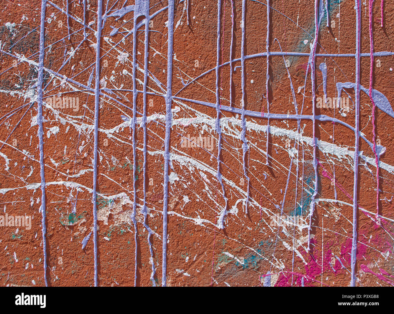 Colorful paint drips and drops on a dark red wall Stock Photo Alamy